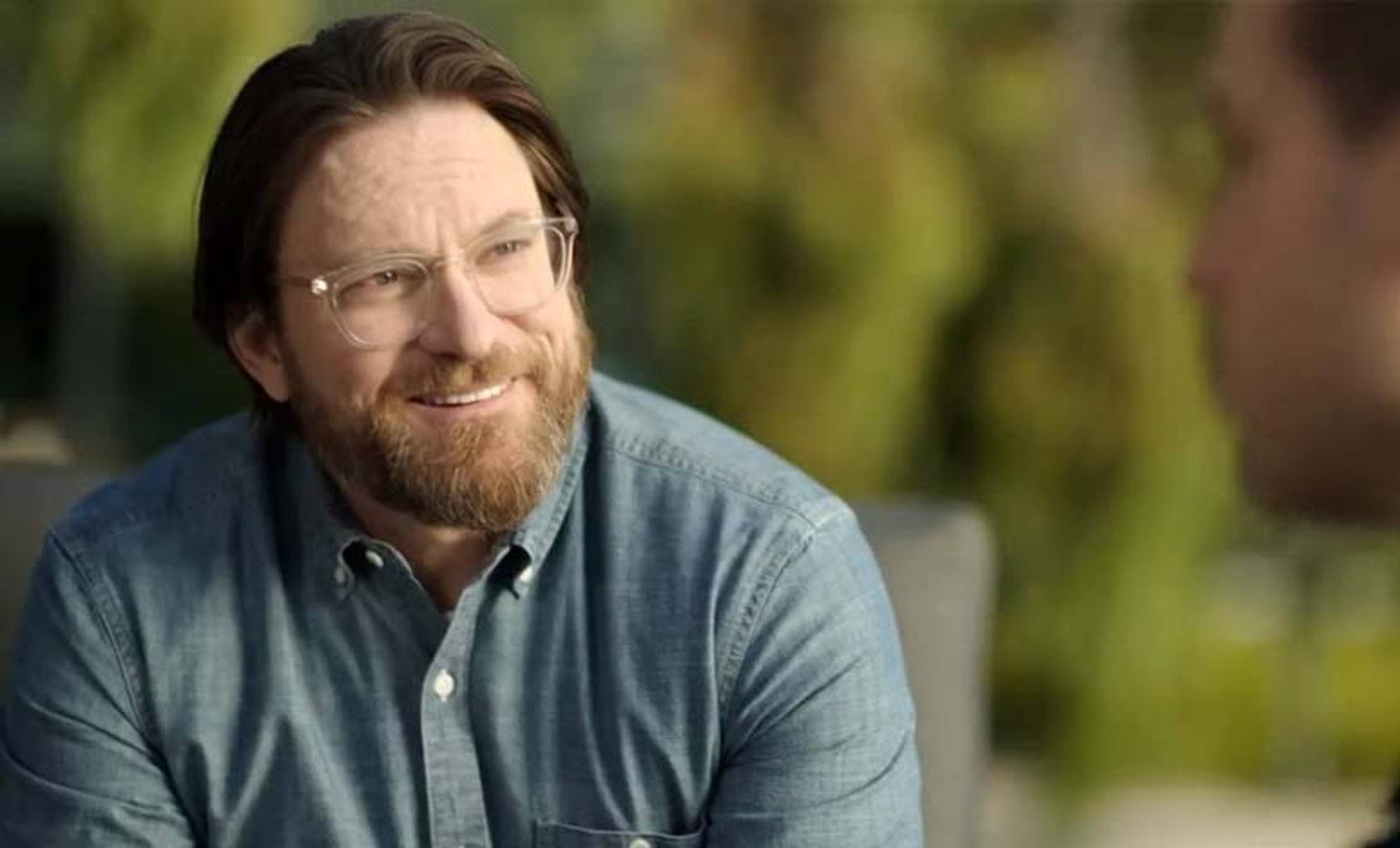 man talking to another person