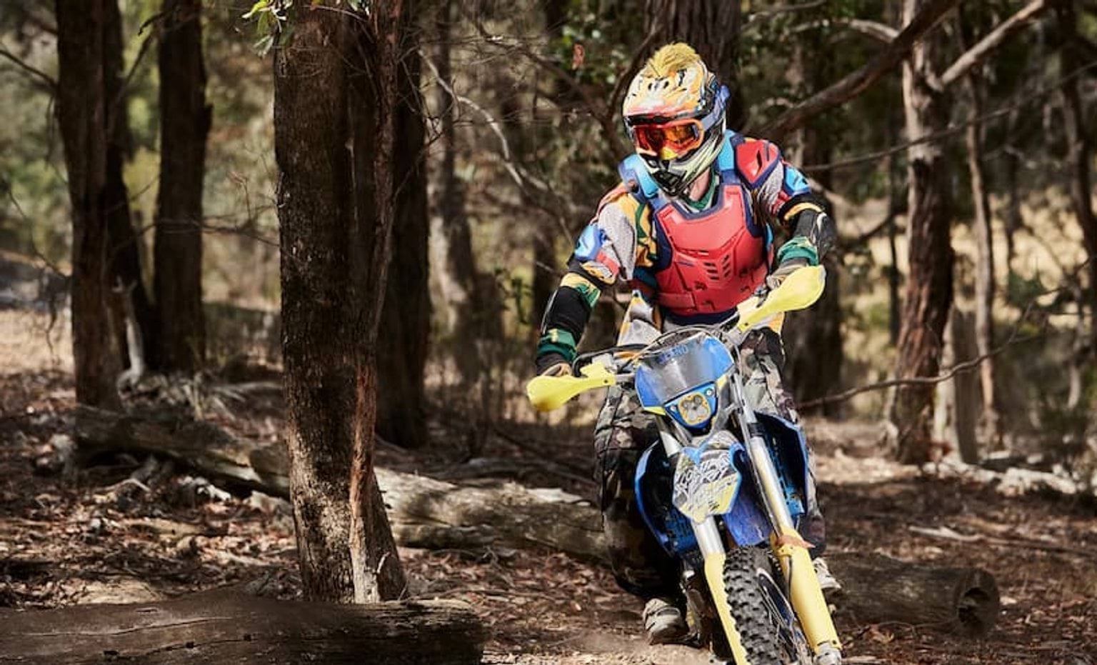 Person on a dirt bike wearing safety gear