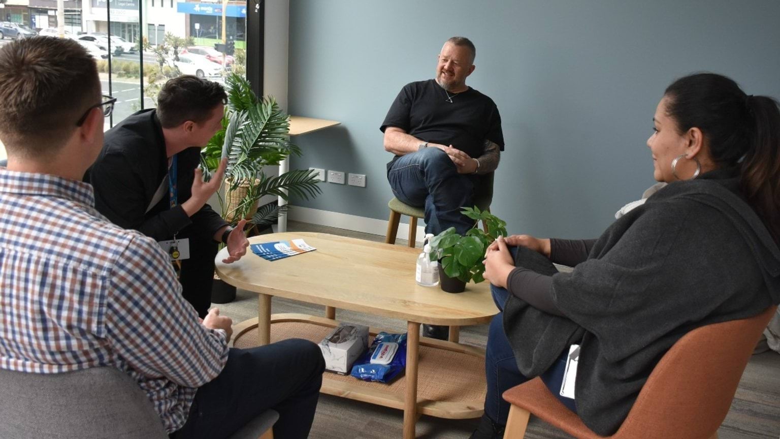 A group of professionals in a meeting around a table
