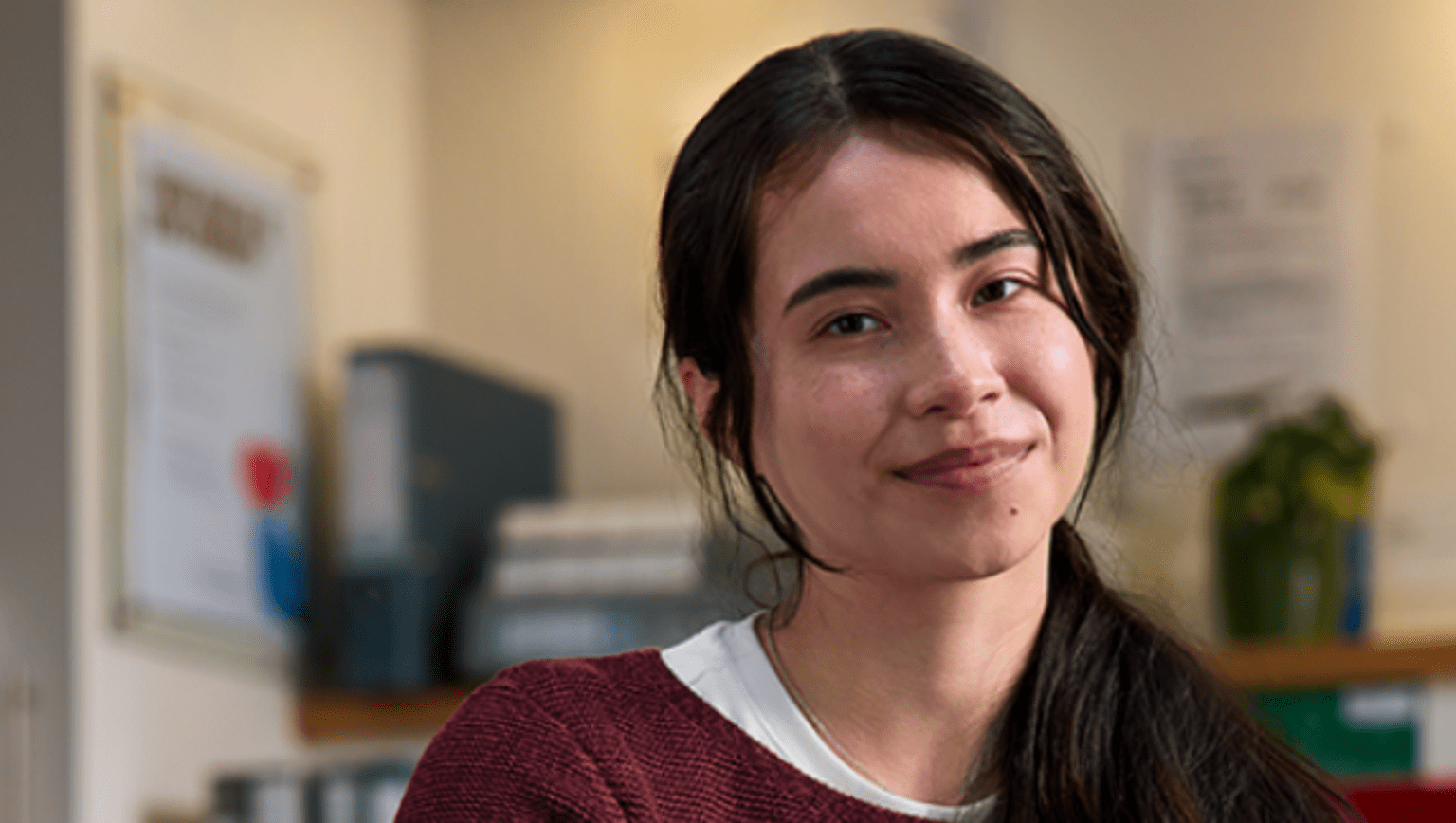 Young woman smiles at camera