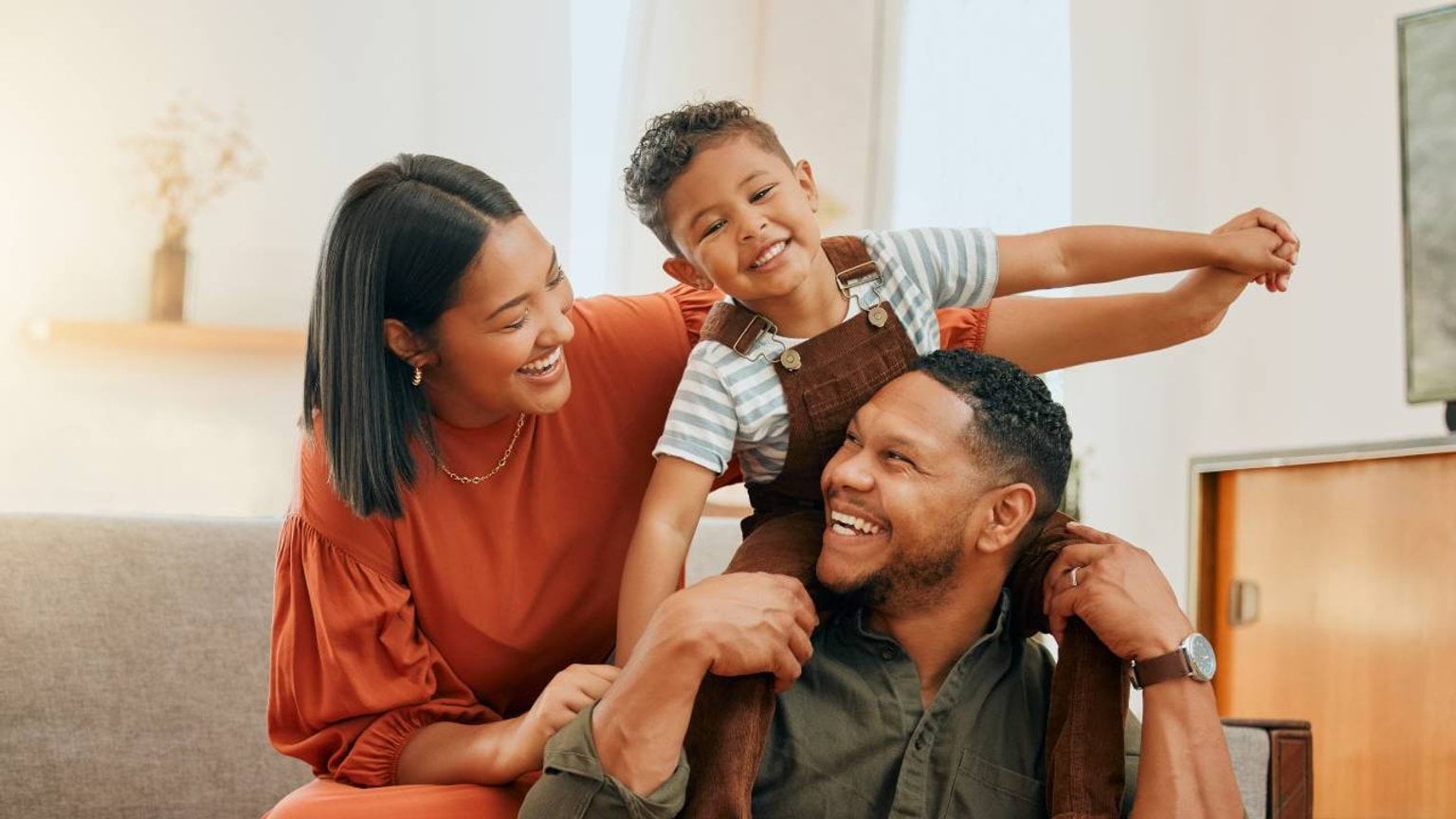Parent play with their child in living room