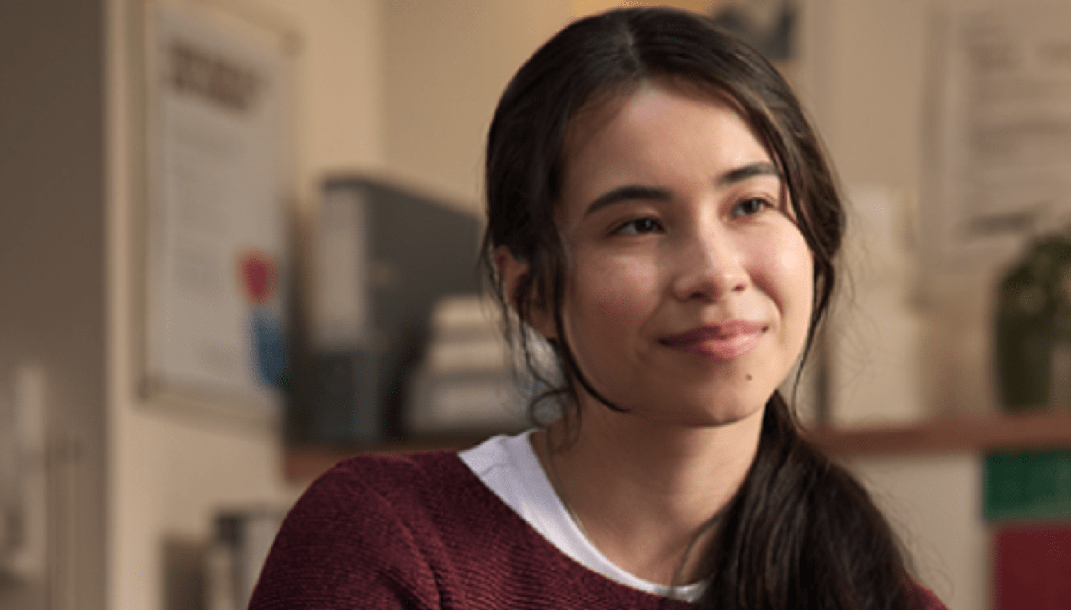 Young woman smiles at camera