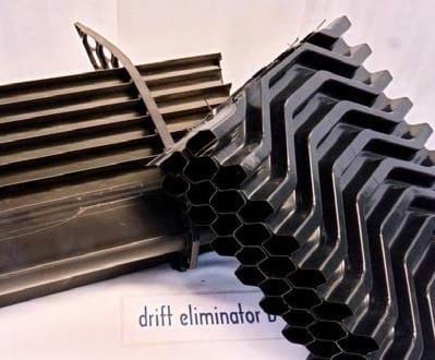 photo 1: Cooling tower with basin exposed to sunlight: This cooling tower does not have sunlight protection to the side and basin of the towerphoto 2: Automated biocide dosing: This device has a timer which controls a pump to inject a pre-set volume of biocide into the waterphoto 3: Drift eliminator: a typical modern drift eliminatorphoto 4: Modern fill: Fill made of materials such as polypropylene is now available for retrofitting to most types of cooling towers.